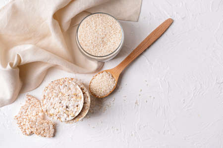 Stack of rice crackers on light backgroundの写真素材