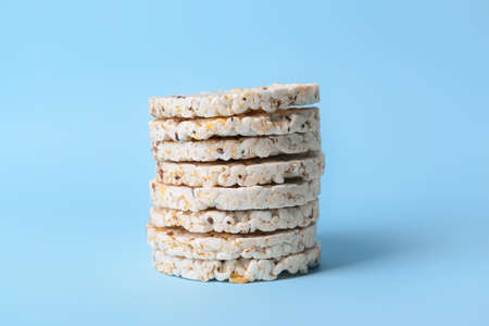 Stack of rice crackers on color backgroundの写真素材
