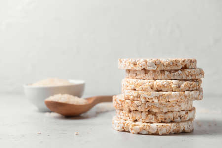 Stack of rice crackers on light backgroundの写真素材