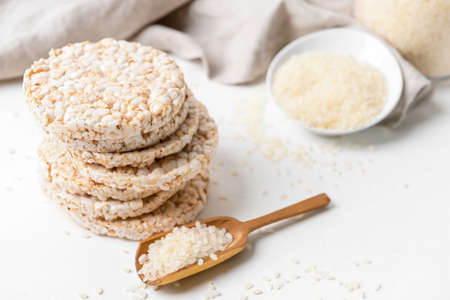 Stack of rice crackers on light backgroundの写真素材