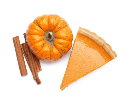 Composition with slice of tasty pumpkin pie on white backgroundの写真素材