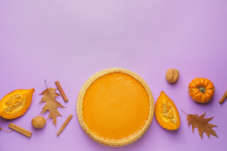 Composition with tasty pumpkin pie on color backgroundの写真素材