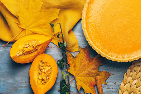 Composition with tasty pumpkin pie on wooden backgroundの写真素材