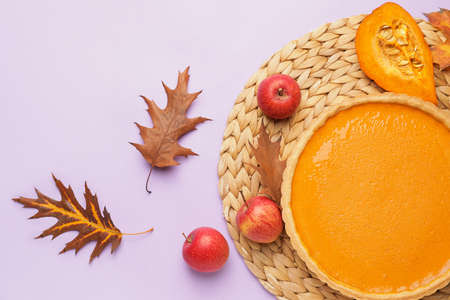 Composition with tasty pumpkin pie on color backgroundの写真素材
