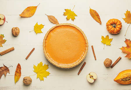Composition with tasty pumpkin pie on light backgroundの写真素材