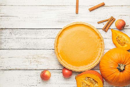 Composition with tasty pumpkin pie on wooden backgroundの写真素材