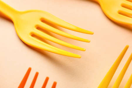 Plastic forks on color backgroundの写真素材