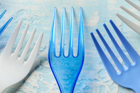 Plastic forks on color backgroundの写真素材