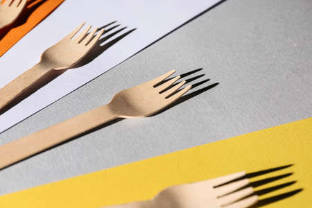 Wooden forks on color backgroundの写真素材