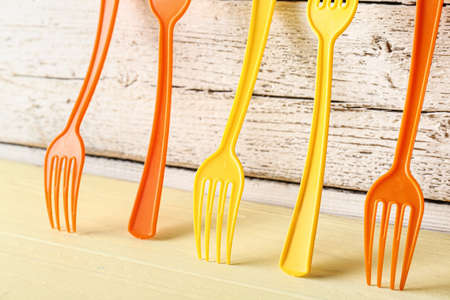 Plastic forks on color table