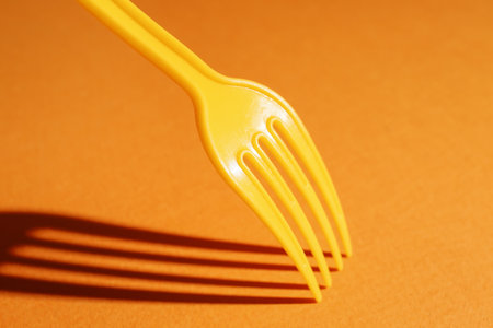 Plastic fork on color backgroundの写真素材