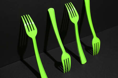 Plastic forks on dark backgroundの写真素材
