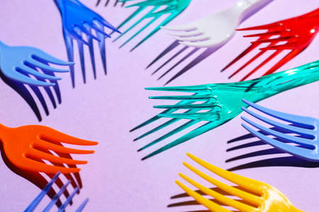 Plastic forks on color backgroundの写真素材