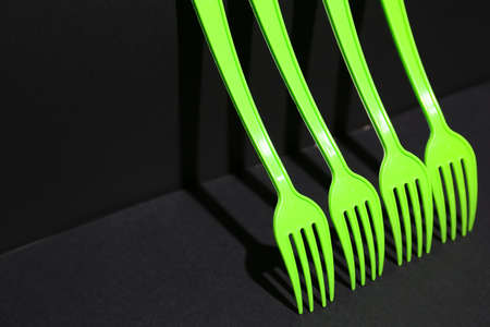 Plastic forks on dark backgroundの写真素材