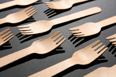 Wooden forks on dark backgroundの写真素材