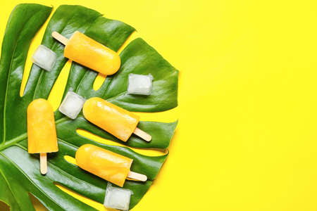 Composition with mango ice cream on color backgroundの写真素材