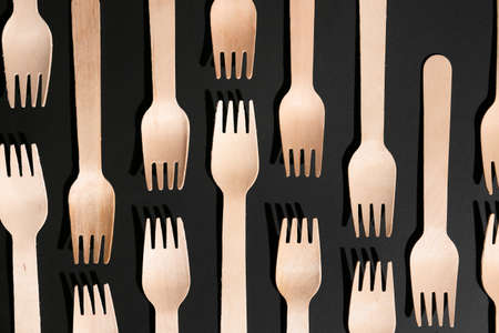 Wooden forks on dark backgroundの写真素材