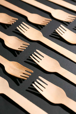 Wooden forks on dark backgroundの写真素材