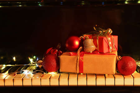 Grand piano decorated for Christmas and gifts, closeupの写真素材