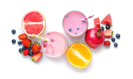 Glasses of tasty smoothie with fruits on white backgroundの写真素材