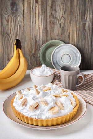 Plate with tasty banana pie on tableの写真素材