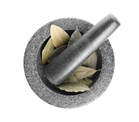 Mortar with bay leaves and pestle on white backgroundの写真素材