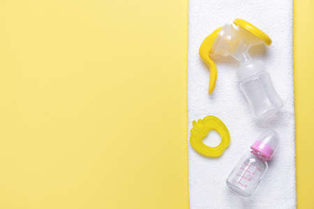 Breast pump and baby accessories on color backgroundの写真素材