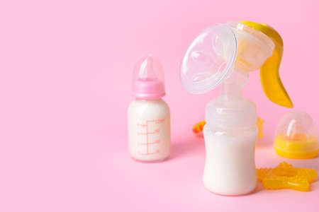 Breast pump and baby accessories on color backgroundの写真素材