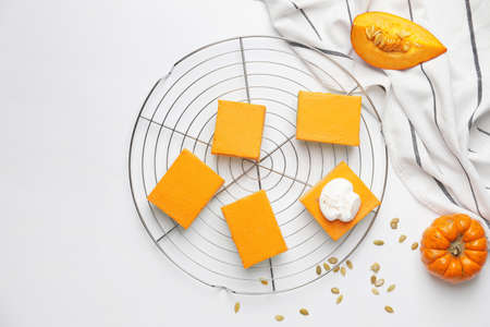 Pieces of tasty pumpkin pie on white backgroundの写真素材