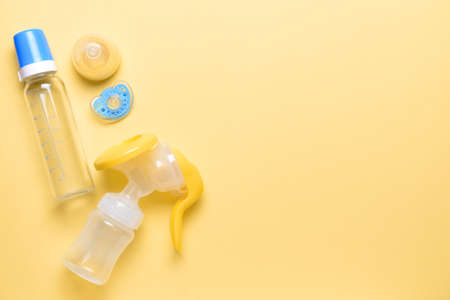 Breast pump and baby accessories on color backgroundの写真素材