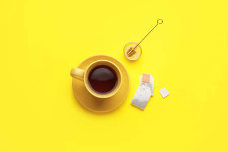Composition with cup of tea on color backgroundの写真素材