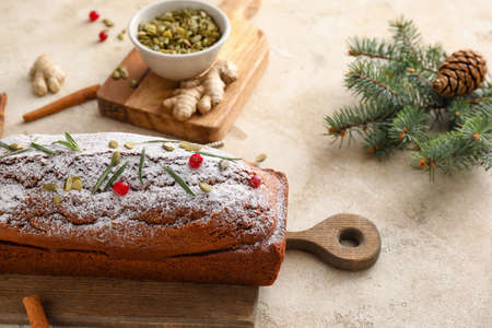 Composition with tasty gingerbread cake on light background