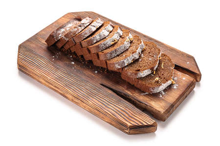 Board with tasty gingerbread cake on white background