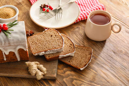 Composition with tasty gingerbread cake on wooden backgroundの写真素材