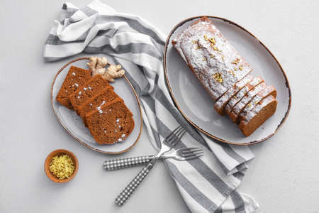 Composition with tasty gingerbread cake on light backgroundの写真素材