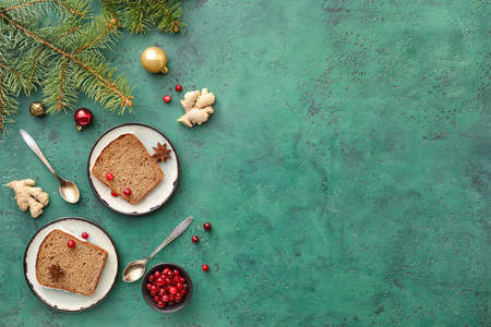 Plates with pieces of gingerbread cake on color backgroundの写真素材