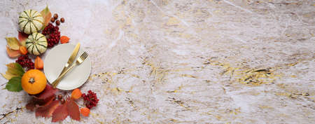 Beautiful table setting with autumn decor on grunge background with space for textの写真素材