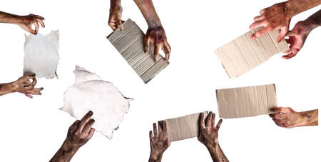 Many hands of scary zombies with blank paper sheets on white backgroundの写真素材