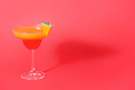 Glass of tasty pumpkin pie martini on color backgroundの写真素材