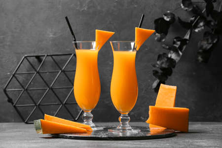 Glasses of tasty pumpkin pie martini on dark backgroundの写真素材