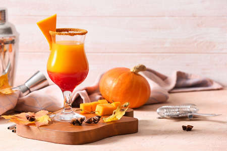 Glass of tasty pumpkin pie martini on tableの写真素材