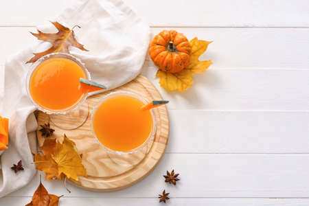 Autumn composition with pumpkin pie martini on white wooden backgroundの写真素材
