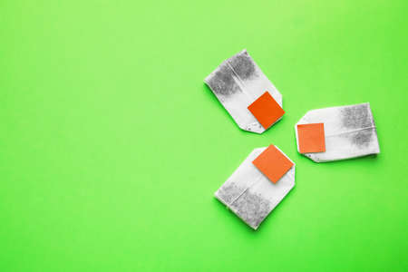 Tea bags on color backgroundの写真素材