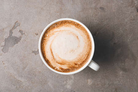 Cup of tasty latte on grunge backgroundの写真素材