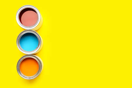 Cans of paints on color backgroundの写真素材