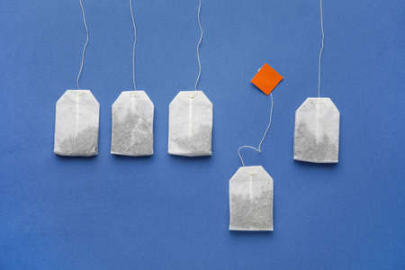 Tea bags on color backgroundの写真素材