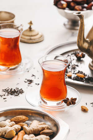 Glasses of tasty Turkish tea on light backgroundの写真素材