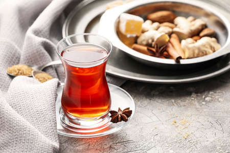 Glass of tasty Turkish tea on gray backgroundの写真素材