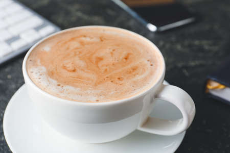 Cup of tasty latte on dark background, closeupの写真素材