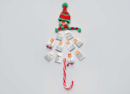 Christmas tree shape made of tea bags on light backgroundの写真素材